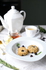 Blueberry scones. a Traditional British baked good for tea time. set on cafe table.
