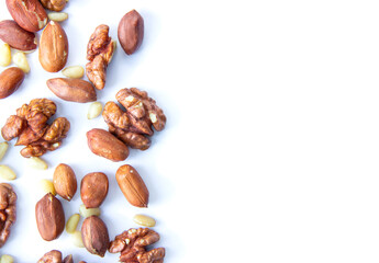 pine nuts and walnuts on a white background