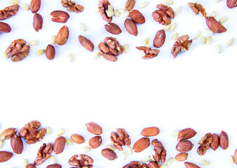 pine nuts and walnuts on a white background