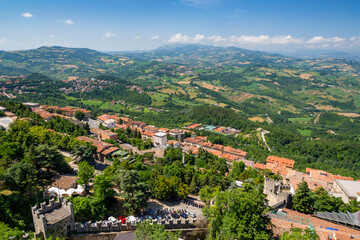 Fototapeta na wymiar Aerial view of republic San Marino and Palm riviera, Italy, Europe. San Marino landscape with Adriatic sea on the horizon. Amazing cityscape view from Monte Titano.