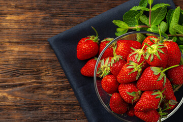 Red ripe fresh strawberry with leaves close up
