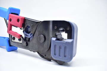 Fototapeta premium reliable tool for crimping connectors and twisted pair RJ-45 on white background