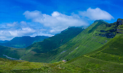 Obraz premium Spring landscape from a drone in the Port of Las Estacas de Trueba. Pasiegos Valleys. Merindades region. Burgos province. Community of Castilla y León. Spain, Europe