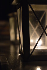 candle lantern on wooden table