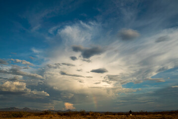 A rainbow appears in a monsoonal storm.