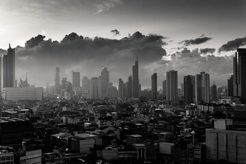 Bangkok city with high buildings in downtown and dramatic sky at dawn