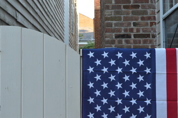 american flag on fence