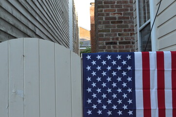 american flag on fence