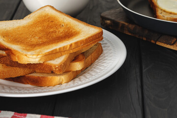 Toasted bread close up on wooden table