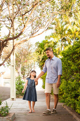 .Father and daughter walking outdoors. Showing affection and love. Father's Day.