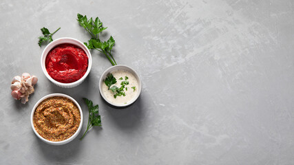 Set of various sauces in bowls