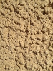 Sandstone wall structure, arbitrary masonry, close-up.