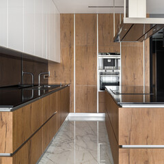 Kitchen with wooden cupboards and wall