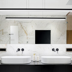 Bathroom with two oval washbasins