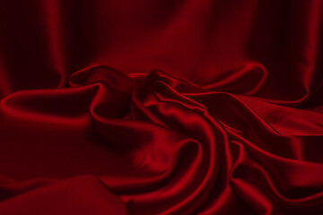 Red silk or satin luxury fabric texture can use as abstract background.