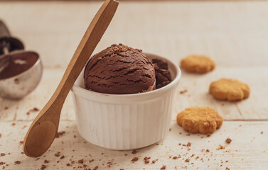 Scoops of ice cream on wooden background