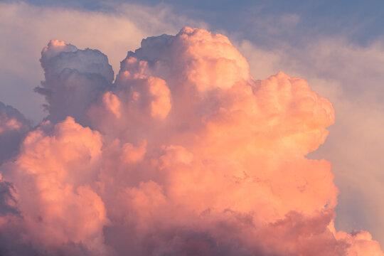 Bright colorful cumulonimbus clouds at sunset.