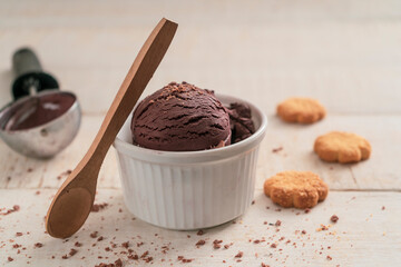 Scoops of ice cream on wooden background