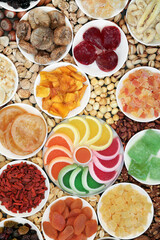 Dried nut and fruit selection forming an abstract background. Health food high in antioxidants, protein, omega 3, minerals, vitamins and anthocyanins. Flat lay.