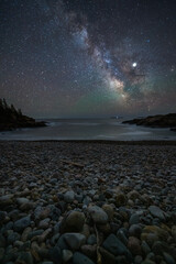 Pebble beach and the Milky Way.