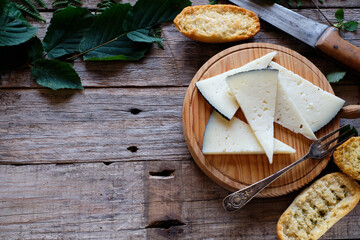 Cured cheese with rustic background