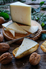 Cured cheese with rustic background