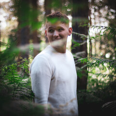 portrait of a young man in forest