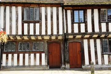 Beautiful wall, wooden doors, old windows frame in the building, typical Tudor English style in Stratford  Upon Avon, England, UK
