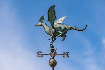 Fototapeta na wymiar Brass and Copper Dragon with wings Weathervane