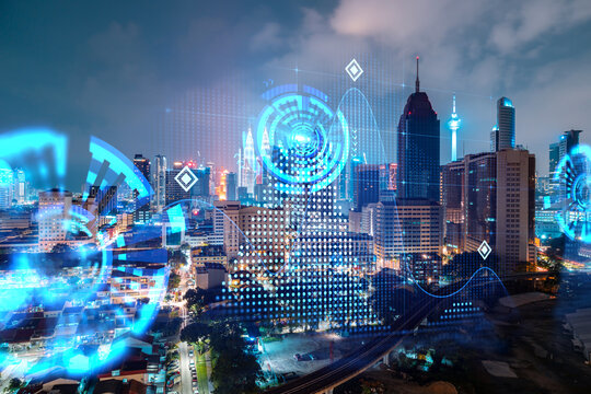 Abstract Technology Icons, Night Aerial Panoramic Cityscape Of Kuala Lumpur, Malaysia, Asia. The Concept Of Innovative Approach To Optimize International Business Process. Double Exposure.