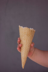 Ice cream cone in the hands of a child
