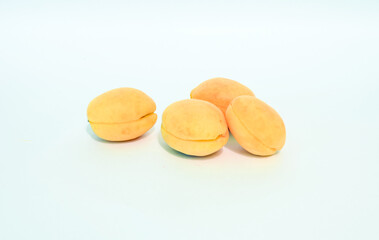 Fruits and berries on a white background, raspberries, strawberries, peaches, plums, apricots