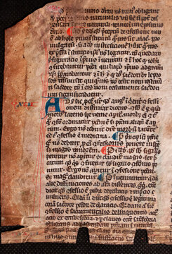 A manuscript on vellum of St Thomas Aquinas written in the twelfth or thirteenth century with rubricated red initials. 