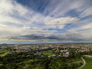 Naklejka premium Beautiful view from above of the city in southern Germany against a background of blue sky and white clouds