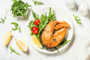 Salmon fish with fresh salad.