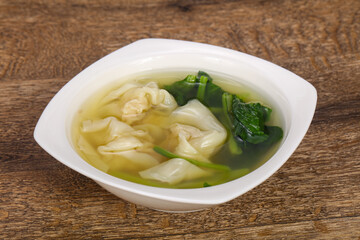 Asian traditional Wonton soup with herbs