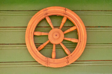 The wheel is spindled as an ancient traditional symbol of the sun.