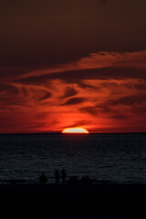 Deep glowing red summer sunset at Mayflower Beach, Cape Cod.