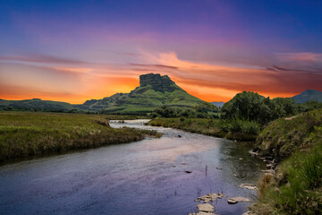 Twilight over a valley river in the Drakensberg mountain in Kwazulu Natal South Africa