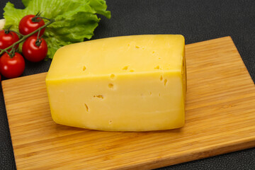 Hard yellow tasty cheese brick