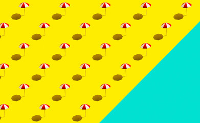 Beach umbrellas parasols on yellow blue background pattern. ocean and beach theme. Beach vacation concept.