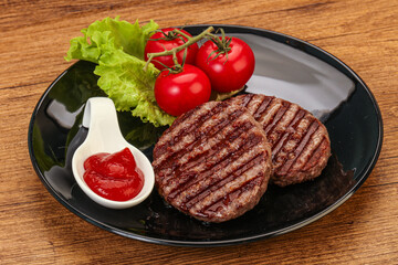 Grilled burger cutlet with sauce