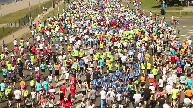 many running people during summer city marathon competitions