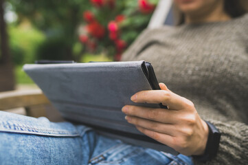 Woman using tablet pc in the countryside. Good internet communication concept.