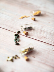 Seeds of flowers on wooden background.