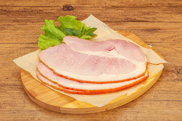 Sliced pork belly over board