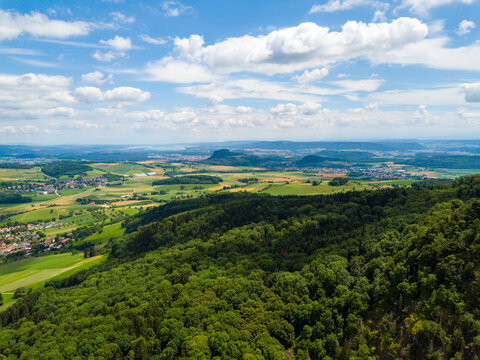 Aerial view over the long extinct volcanoes of the Hegau region towards Lake Constance in Germany.