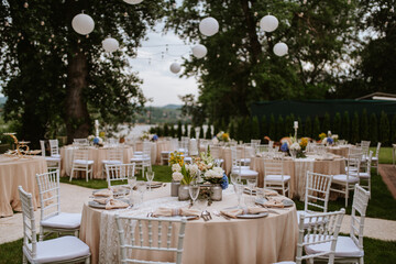 Beautiful pastel floral decoration for outdoor celebration by the river