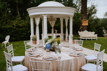 Beautiful pastel floral decoration for outdoor celebration by the river