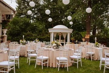 Beautiful pastel floral decoration for outdoor celebration by the river